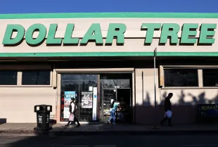 LOS ANGELES, CALIFORNIA - NOVEMBER 23: People walk past a Dollar Tree store on November 23, 2021 in Los Angeles, California. The company announced it will permanently increase prices from $1.00 to $1.25 on most of its items in a move it said was ‘not a reaction to short-term or transitory market conditions’. (Photo by Mario Tama/Getty Images)