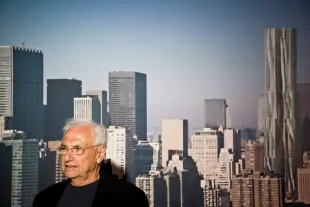 The architect Frank Gehry (in front of a rendering of the Beekman Tower) at a press event unveiling his design for The Beekman Tower, a 76-storey, 867ft luxury apartment tower in lower Manhattan. (Photo by James Leynse/Corbis via Getty Images)