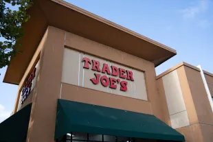 Trader Joe's grocery store exterior with red signage and green awning on a clear day, South San Francisco, California, October 16, 2025. (Photo by Smith Collection/Gado/Getty Images)