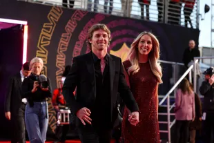 LAS VEGAS, NV - FEBRUARY 8: Braxton Berrios #0 of the Miami Dolphins arrives with influencer Alix Earle at the red carpet at the 13th Annual NFL Honors on February 8, 2024 in Las Vegas, Nevada. (Photo by Perry Knotts/Getty Images)