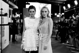 LONDON, ENGLAND - OCTOBER 19: (EDITORS NOTE: Image has been converted to black and white.) Emma Corrin and Maika Monroe attend the "100 Nights of Hero" Closing Gala at the 69th BFI London Film Festival at The Royal Festival Hall on October 19, 2025 in London, England. (Photo by Jeff Spicer/Getty Images for BFI)