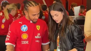 Ana de Armas examines a Ferrari steering wheel as Lewis Hamilton guides a quick garage walkthrough at Yas Marina. Image via X/@TorettoOffcl.