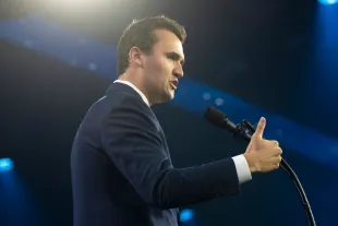 Turning Point USA executive director Charlie Kirk speaks during Turning Point USA's AmericaFest at the Phoenix Convention Center (Image via Getty)