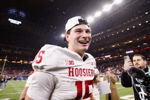 Fernando Mendoza #15 of the Indiana Hoosiers celebrates after defeating the Ohio State Buckeyes 13-10 in the 2025 Big Ten Football Championship at Lucas Oil Stadium on December 06, 2025 in Indianapolis, Indiana.  (Photo by Michael Reaves/Getty Images)