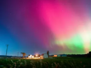 The Aurora Borealis lights up the night sky over Monroe, Wisconsin, on November 11, 2025, during one of the strongest solar storms in decades (Image via Getty)