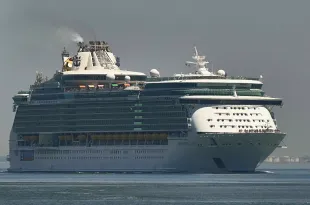 LISBON, PORTUGAL - MAY 28: MS Independence of the Seas, a 155,889 GT Freedom-class cruise ship operated by the Royal Caribbean cruise line, sails the Tagus River after departure from the cruise terminal on May 28, 2025, in Lisbon, Portugal. Tourism in Portugal reached record figures in 2024, exceeding 27 billion euros in revenue, an increase of 8.8% compared to 2023. (Photo by Horacio Villalobos#Corbis/Corbis via Getty Images)