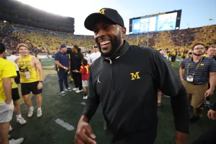 ANN ARBOR, MICHIGAN - SEPTEMBER 21: Head coach Sherrone Moore of the Michigan Wolverines celebrates a 27-24 win over the USC Trojans at Michigan Stadium on September 21, 2024 in Ann Arbor, Michigan. (Photo by Gregory Shamus/Getty Images)