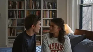 Robert Pattinson as Charlie and Zendaya as Emma, share a tense pause in The Drama, set days before their wedding. Image via A24.