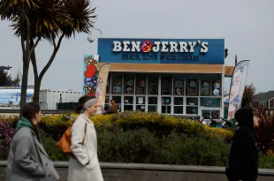 SAN FRANCISCO, CALIFORNIA - MARCH 19: People walk by a Ben and Jerry's ice cream shop on March 19, 2025 in San Francisco, California. Ice cream maker Ben and Jerry's is accusing its parent company, Unilever, of dismissing CEO David Stever for supporting Ben and Jerry's political activism. (Photo by Justin Sullivan/Getty Images)