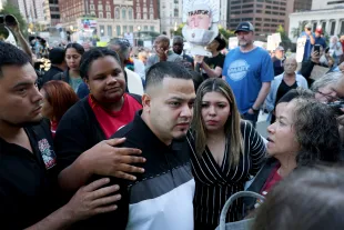 BALTIMORE, MARYLAND - AUGUST 25: Surrounded by reporters, Kilmar Abrego Garcia and his wife Jennifer Vasquez Sura enter a U.S. Immigration and Customs Enforcement (ICE) field office on August 25, 2025 in Baltimore, Maryland. The U.S. Government is threatening to deport Garcia, a Maryland construction worker from El Salvador, to Uganda after he rejected a plea deal to be charged with Human Smuggling and deported to Costa Rica. Earlier this year Garcia was wrongfully deported to a notorious anti-terrorism prison CECOT in El Salvador. (Photo by Anna Moneymaker/Getty Images)