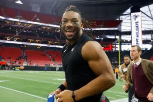 ATLANTA, GEORGIA - DECEMBER 24: Bijan Robinson #7 of the Atlanta Falcons runs on the field after a win over the Indianapolis Colts at Mercedes-Benz Stadium on December 24, 2023 in Atlanta, Georgia. (Photo by Todd Kirkland/Getty Images)