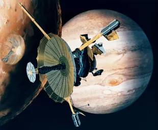 NASA's Galileo probe passing over one of Jupiter's 16 moons (Image via Getty)