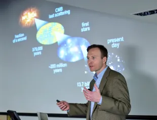 Professor John Kovac speaking about a new discovery of the Big Bang Theory (Image via Getty)
