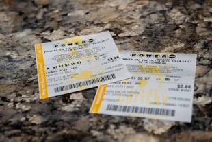 AUSTIN, TEXAS - OCTOBER 10: In a photo illustration, Powerball lottery tickets are seen on a countertop on October 10, 2023 in Austin, Texas. The Powerball jackpot has grown to over $1.7 billion, making it the second-largest jackpot in history. (Photo Illustration by Brandon Bell/Getty Images)