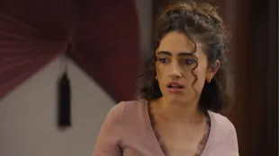 Rachel Sennott as Maia stares ahead in shock as her day unravels, moments before the fallout that costs her everything. Image via Youtube/@HBO Max