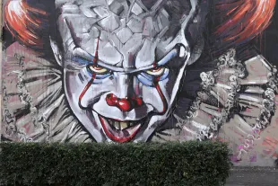 SYDNEY, AUSTRALIA - AUGUST 28:  A wall mural of Pennywise the clown from the movie "IT" painted by Scott Marsh is seen on Cleveland street wall in the suburb of Chippendale on August 28, 2017 in Sydney, Australia. The movie "IT" based on the 1986 horror novel by American author Stephen King is set for release in cinemas on September 7th. (Photo by Mark Kolbe/Getty Images)