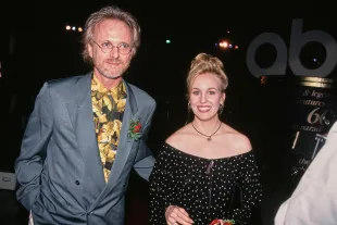 American actor Anthony Geary, wearing a blue blazer over a black-and-gold shirt, and American actress Genie Francis, who wears an off-shoulder black-and-white polka dot dress, attend an event in the United States, 1993. (Photo by Vinnie Zuffante/Getty Images)