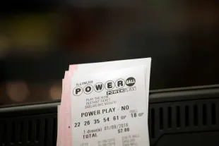 CHICAGO, IL - JANUARY 9 : Powerball tickets rest on a 7-Eleven store register January 9, 2016 in Chicago, Illinois. The Powerball Jackpot Surged to a record $900 Million in 44 States, Washington D.C., Puerto Rico, and the US Virgin Islands before tonight's drawing. (Photo by Joshua Lott/Getty Images)