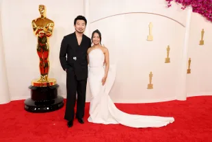 HOLLYWOOD, CALIFORNIA - MARCH 10: (L-R) Simu Liu and Allison Hsu attend the 96th Annual Academy Awards on March 10, 2024 in Hollywood, California. (Photo by Mike Coppola/Getty Images)