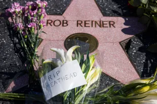Los Angeles, CA - December 15, 2025: Flowers are seen placed ontop of Rob Reiner's Hollywood Walk of Fame Star on Monday, Dec. 15, 2025 in Los Angeles, CA. Nick Reiner was arrested on suspicion of homicide of his parents Rob and Michele Singer Reiner after they were found dead at their Brentwood home on Sunday. (Kayla Bartkowski / Los Angeles Times via Getty Images)