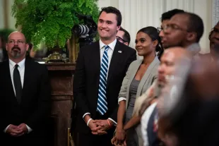 WASHINGTON, DC - JANUARY 2 : Charlie Kirk and Candace Owens from Turning Point USA, listen as President Donald J. Trump speaks during the 2018 Young Black Leadership Summit in the East Room of the White House on Friday, Oct. 26, 2018 in Washington, DC. (Photo by Jabin Botsford/The Washington Post via Getty Images)