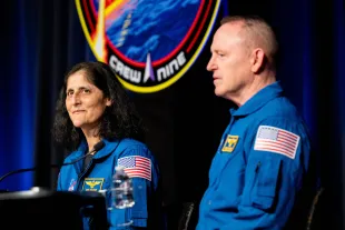 (L-R) Astronauts Sunita "Suni" Williams, and Barry "Butch" Wilmore speak during a news conference at the NASA Johnson Space Center on March 31, 2025 in Houston, Texas. Williams and Wilmore answered questions regarding their SpaceX Crew-9 mission and extended time on the International Space Station. The two astronauts were launched to the ISS aboard a Boeing Starliner spacecraft for a scheduled eight-day mission in June 2024. After spacecraft malfunctions the pair were directed to stay, prolonging the mission nine months. They returned to Earth on March 18 aboard a SpaceX Dragon spacecraft (Image via Getty)
