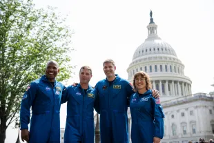 NASA astronauts Victor Glover, Reid Wiseman, Canadian Space Agency astronaut Jeremy Hansen and NASA astronaut Christina Hammock Koch pose for pictures after a news conference about the NASA's Artemis II mission outside the U.S. Capitol May 18, 2023 in Washington, DC. Planned for launch by the Space Launch System in November 2024, the Artemis II mission will include a crewed Orion spacecraft that will perform a lunary flyby and return to Earth (Image via Getty)