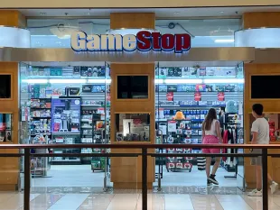 MIAMI, FLORIDA - MAY 28: Merchandise lines the shelves of a GameStop store on May 28, 2024 in Miami, Florida. GameStop stock jumped higher after the video game retailer announced that it had raised $933 million by selling 45 million common shares of its stock earlier this month. (Photo by Joe Raedle/Getty Images)
