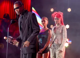 LAS VEGAS, NEVADA - OCTOBER 08: (L-R) In this image released on October 15, 2024, Travis Scott accepts the I Am Hip Hop Award from Tyla and Teyana Taylor onstage during the BET Hip Hop Awards 2024 at Drai's Beachclub & Nightclub on October 08, 2024 in Las Vegas, Nevada. (Photo by Johnny Nunez/Getty Images for BET)