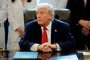 U.S. President Donald Trump speaks to journalists after signing an executive order in the Oval Office of the White House on December 18, 2025 in Washington, DC. (Photo by Anna Moneymaker/Getty Images)
