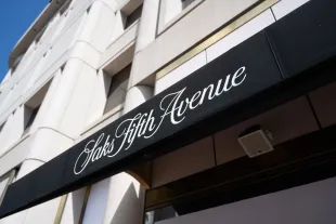 Awning with Saks Fifth Avenue logo outside department store on a clear day, San Francisco, California, May 13, 2025. (Photo by Smith Collection/Gado/Getty Images)