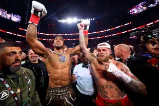 MIAMI, FLORIDA - DECEMBER 19: Anthony Joshua celebrates victory over Jake Paul after their heavyweight bout during Jake Paul v Anthony Joshua at Kaseya Center on December 19, 2025 in Miami, Florida. (Photo by Ed Mulholland/Getty Images for Netflix)
