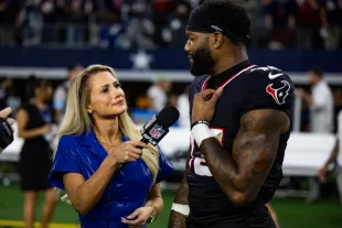 ARLINGTON, TEXAS - NOVEMBER 18: Nico Collins #12 of the Houston Texans is interviewed by Jane Slater after an NFL football game against the Dallas Cowboys at AT&T Stadium on November 18, 2024 in Arlington, Texas. (Photo by Perry Knotts/Getty Images)