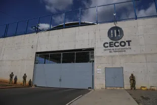 SAN VICENTE, EL SALVADOR - APRIL 04: Soldiers guarding the prison entrance at the Terrorism Confinement Center (CECOT) in Tecoluca, in San Vicente, El Salvador on April 04, 2025. The Cecot prison was presented to Salvadorans by President Nayib Bukele on national radio and television as the largest prison in the Americas, built for members of the Mara Salvatrucha (MS 13) gang and the two Barrio 18 groups (Sureña and Revolucionaria). Following the deportation of hundreds of migrants from the United States to El Salvador, it became a resource for the Donald Trump administration in implementing its immigration policy. (Photo by Alex Pena/Anadolu via Getty Images)