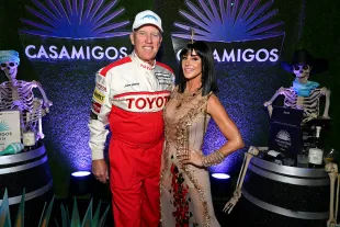 John Elway and Paige Elway attend the Casamigos Halloween Party Returns in Beverly Hills (Image via Getty)