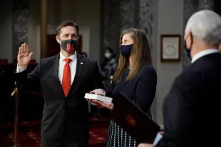 WASHINGTON, DC - JANUARY 3: Sen. Ben Sasse (R-NE), joined by his wife Melissa Sasse, takes the oath of office from Vice President Mike Pence during a mock swearing-in ceremony in the Old Senate Chamber on Capitol Hill on January 3, 2021 in Washington, DC. Both chambers are holding rare Sunday sessions to open the new Congress on January 3 as the Constitution requires.  (Photo by J. Scott Applewhite-Pool/Getty Images)