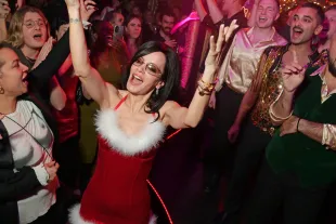 LONDON, ENGLAND - DECEMBER 19: Lily Allen sings along with the London Gay Men's Chorus in London's First And Finest Strip Club, Stringfellows, at her Christmas Party on December 19, 2025 in London, England. (Photo by Dave Benett/Getty Images for Stringfellows)