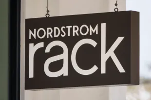 SAN DIEGO, CALIFORNIA - NOVEMBER 7: A Nordstrom Rack logo is displayed on a sign outside a store on November 8, 2025 in San Diego, CA.  (Photo by Kevin Carter/Getty Images)