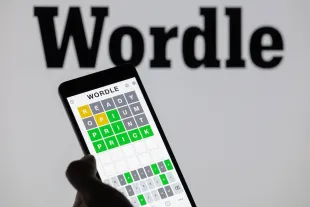 The Wordle game app is being displayed on a smartphone with Wordle visible in the background in this photo illustration in Brussels, Belgium, on June 1, 2024. (Photo by Jonathan Raa/NurPhoto via Getty Images)