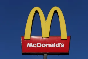 The American fast food company, McDonald's logo is displayed outside one of its stores on January 09, 2024 in Stoke-on-Trent, United Kingdom. (Photo by Nathan Stirk/Getty Images)