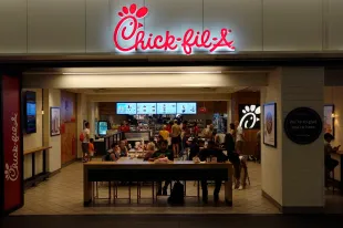 NEW YORK, NY - AUGUST 9: People eat at a Chick-fil-A restaurant in Penn Station on August 9, 2025, in New York City. (Photo by Gary Hershorn/Getty Images)