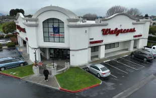 EL CERRITO, CALIFORNIA - MARCH 09: In an aerial view, a customer leaves a Walgreens store on March 09, 2023 in El Cerrito, California. California Gov. Gavin Newsom announced the state of California will cut ties with Walgreens and not renew their $54 million contract with the Walgreens drugstore chain due to their decision to stop selling the abortion pill mifepristone in 21 states due to legal restrictions. (Photo by Justin Sullivan/Getty Images)