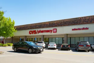 A car drives past a CVS Pharmacy on a sunny day in San Ramon, California, May 31, 2017. (Photo via Smith Collection/Gado/Getty Images).
