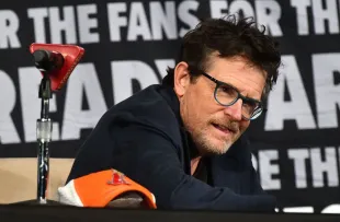 ORLANDO, FLORIDA - FEBRUARY 01: Actor Michael J. Fox smiles during the ‘Back to the Future’ reunion at MegaCon Orlando 2024 at Orange County Convention Center on February 01, 2024 in Orlando, Florida. (Photo by Gerardo Mora/Getty Images)