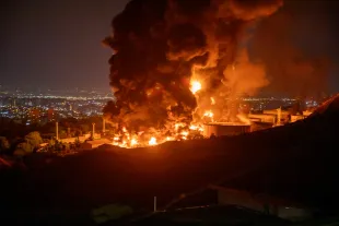 TEHRAN, IRAN - JUNE 15: Fire and smoke rise into the sky after an Israeli attack on the Shahran oil depot on June 15, 2025 in Tehran, Iran. Iran's foreign minister said the country would respond decisively and proportionally to a wave of attacks that Israel launched beginning in the early hours of June 13. The attacks targeted multiple military, scientific and residential locations, as well as senior government officials. (Photo by Stringer/Getty Images)