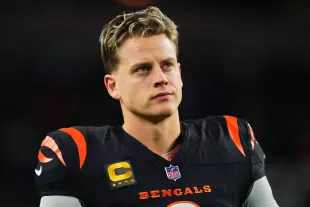 ARLINGTON, TX - DECEMBER 09: Joe Burrow #9 of the Cincinnati Bengals warms up before kickoff against the Dallas Cowboys during an NFL football game at AT&T Stadium on December 9, 2024 in Arlington, Texas. (Photo by Cooper Neill/Getty Images)