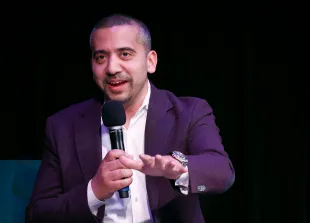 WASHINGTON, DC - APRIL 25: Mehdi Hasan speaks onstage during  the Crooked Media - Lovett or Leave It: Live on Tour, on April 25, 2024 in Washington, DC. (Photo by Paul Morigi/Getty Images for Crooked Media)