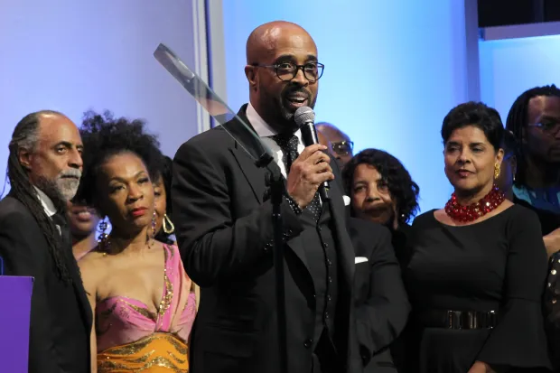 Dr. Frederick Douglass Haynes III (C) speaks onstage during the National CARES Mentoring Movement 4th Annual For The Love Of Our Children Gala (Image via Getty)
