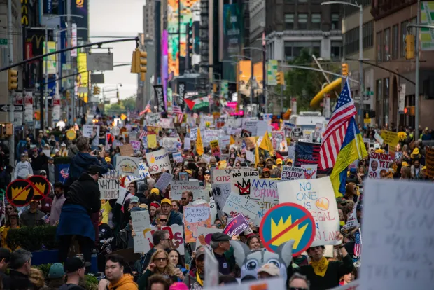 Over one hundred thousand people gather and march in Manhattan, New York City, on October 18, 2025, for the No Kings protest. Peaceful demonstrations take place across the country as millions advocate against the policies of the Trump Administration. No arrests are made in New York City. (Photo by Neil Constantine/NurPhoto via Getty Images)