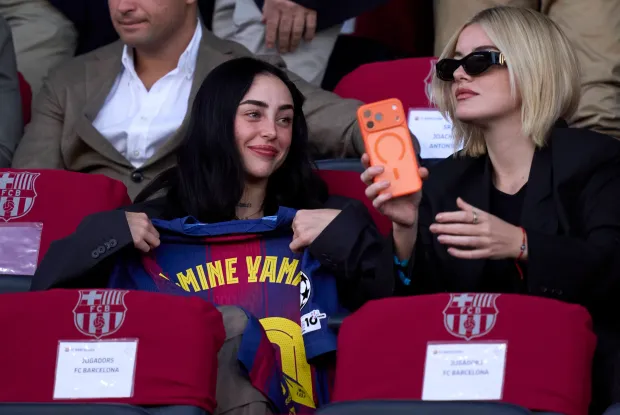 BARCELONA, SPAIN - OCTOBER 21: Singer Nicki Nicole holds a Lamine Yamal's jersey at the stands for the UEFA Champions League 2025/26 League Phase MD3 match between FC Barcelona and Olympiacos FC at Estadi Olimpic Lluis Companys on October 21, 2025 in Barcelona, Spain. (Photo by Pedro Salado/Getty Images)